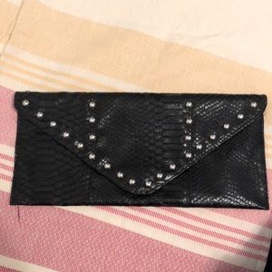 Black clutch with studs